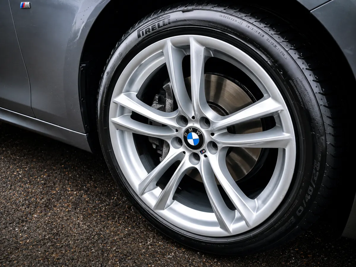 Clean BMW wheel and dressed tyre after detailing